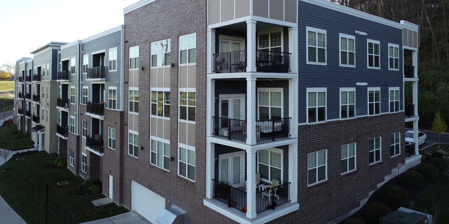 Bolt-on aluminum balcony systems with integrated railings