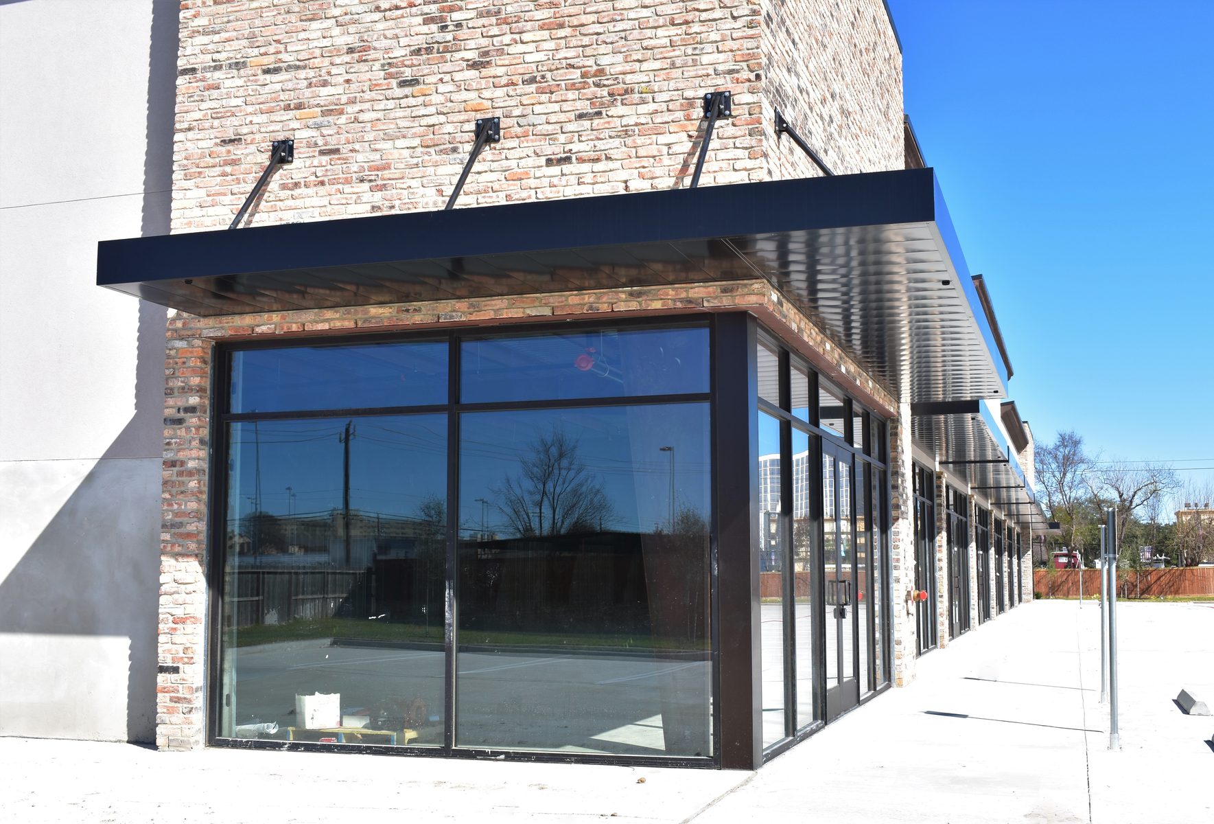 Architectural aluminum canopy system on commercial building entrance