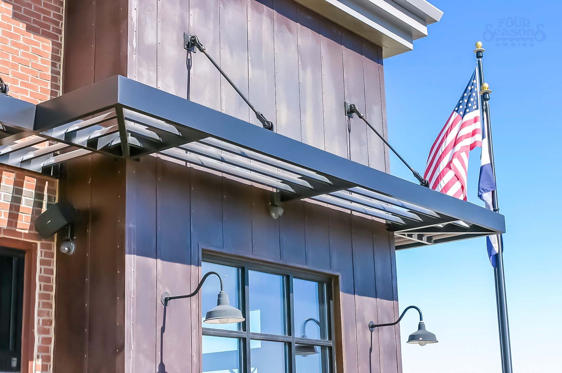 Commercial aluminum sunshade canopy system on building facade