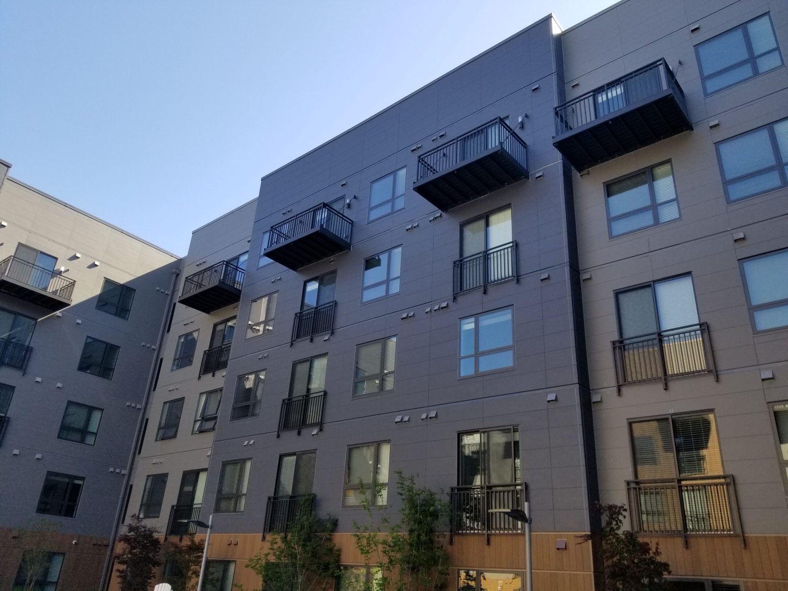 Aluminum railing installation on commercial building exterior